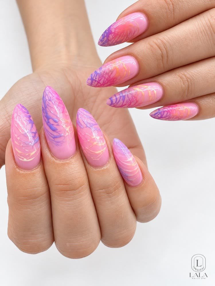 Pink acrylic nails with a marbled design at Lala Nails Spa in Winnetka, CA